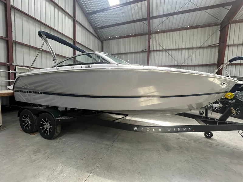The Image of 2025 Four Winns H2 boat in a warehouse on a trailer. - 0