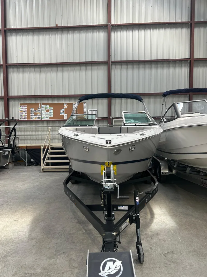 Slide: The Image of 2025 Four Winns H2 boat interior with sleek gray seating and modern design. - 11