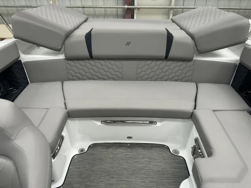 Slide: The Image of 2025 Four Winns H2 boat interior with gray cushioned seating and modern design. - 18