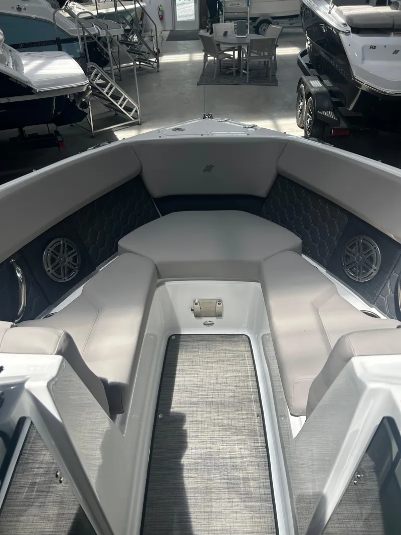 Slide: The Image of 2025 Four Winns H2 boat interior with modern dashboard and comfortable seating. - 5