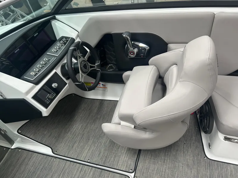 Slide: The Image of 2025 Four Winns H2 boat interior with modern seating and sleek dashboard design. - 6
