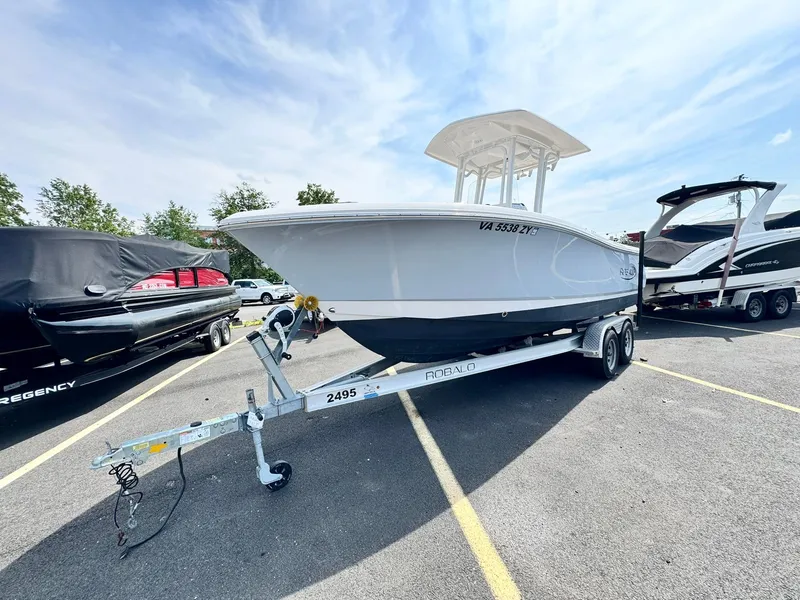 Slide: The Image of 2022 Robalo R230 Center Console boat on trailer in parking lot. - 3
