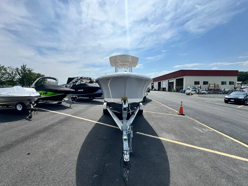 Slide: The Image of 2022 Robalo R230 Center Console boat on trailer in parking lot. - 4