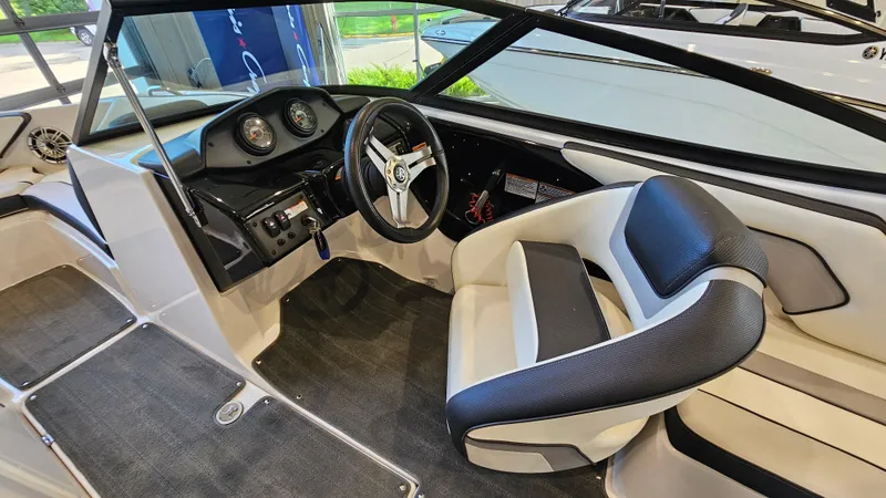 Slide: The Image of 2017 Yamaha AR195 boat interior with steering wheel and dashboard controls. - 12