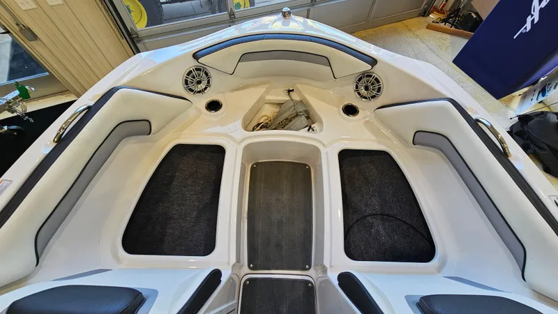 Slide: The Image of 2017 Yamaha Boats AR195 interior with cushioned seating and speakers. - 18