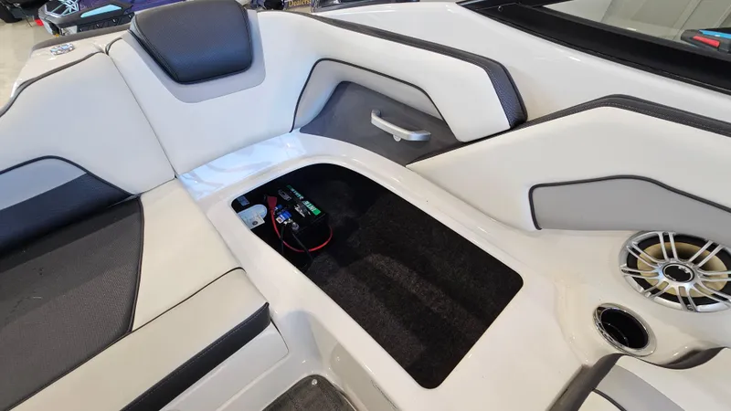 Slide: The Image of 2017 Yamaha AR195 boat interior with storage compartment and speaker. - 21