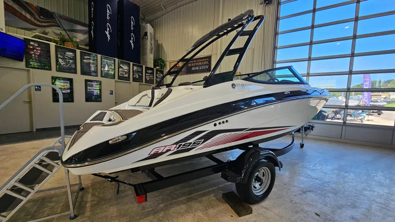 Slide: The Image of 2017 Yamaha AR195 boat displayed indoors on a trailer. - 3