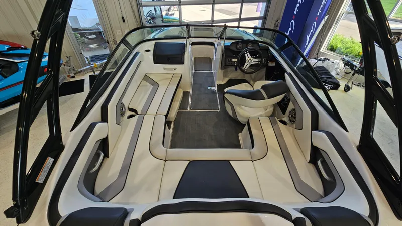 Slide: The Image of 2017 Yamaha Boats AR195 interior with sleek seating and modern dashboard design. - 6