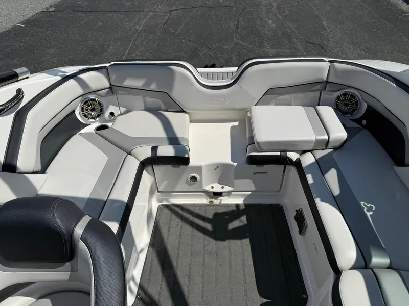 Slide: The Image of 2016 Yamaha Boats 212X interior with sleek seating and built-in speakers. - 10