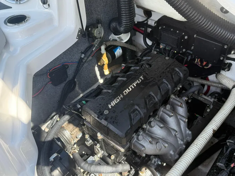Slide: The Image of Engine compartment of a 2016 Yamaha Boats 212X, featuring a high output engine. - 12