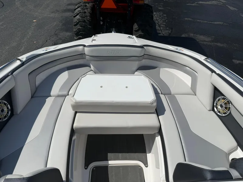 Slide: The Image of 2016 Yamaha Boats 212X interior with cushioned seating and speakers. - 18