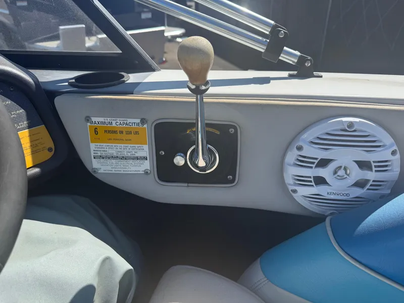 Slide: The Image of 1991 Correct Craft Ski Nautique 196 interior with gear shift and Kenwood speaker. - 8