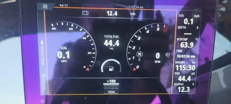 Slide: The Image of Dashboard display of a 2023 Sea Ray SDX 270 boat showing speed, fuel, and engine data. - 13
