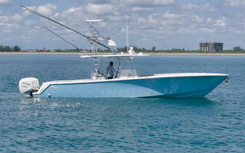 The Image of 2020 SeaVee 39 boat on calm ocean with clear sky and distant shoreline. - 1