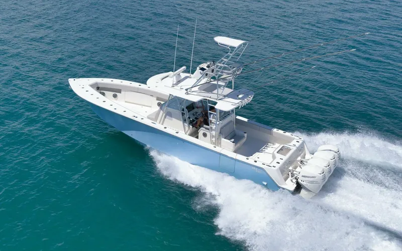 Slide: The Image of 2020 SeaVee 39 boat cruising on clear blue ocean waters. - 11