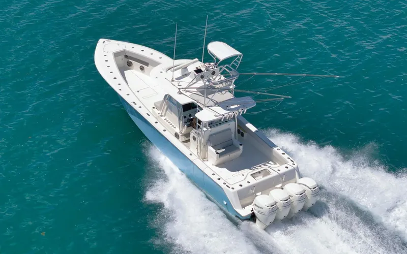 Slide: The Image of 2020 SeaVee 39 boat cruising on clear blue water, showcasing powerful engines. - 12