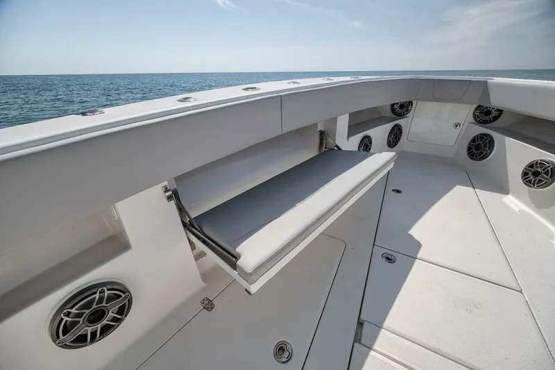Slide: The Image of 2020 SeaVee 39 boat interior with seating and speakers, ocean view. - 21
