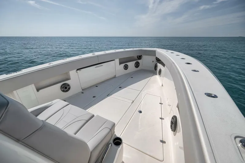 Slide: The Image of 2020 SeaVee 39 boat deck with ocean view, featuring spacious seating and modern design. - 25