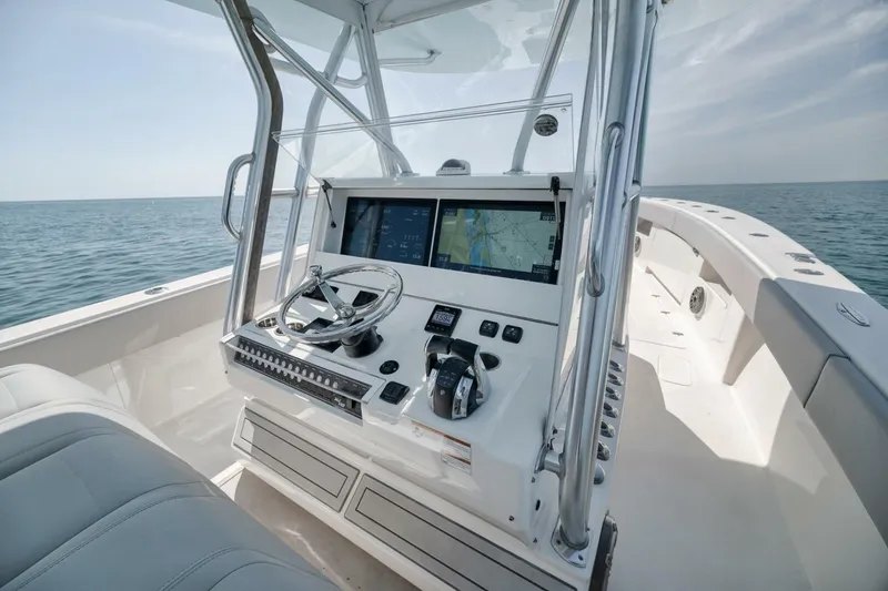 Slide: The Image of 2020 SeaVee 39 boat helm with dual screens and ocean view. - 28