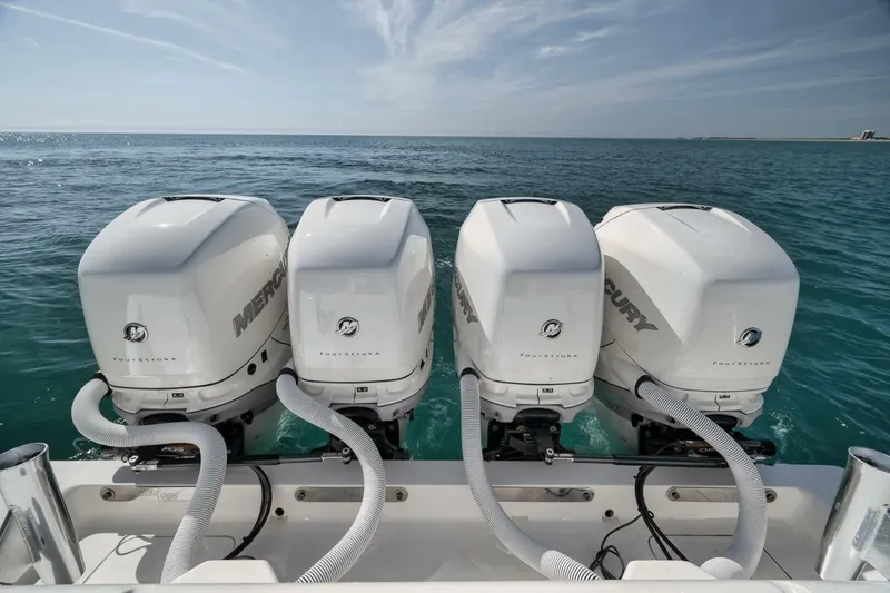 Slide: The Image of Four Mercury outboard engines on a 2020 SeaVee 39 boat in open water. - 36