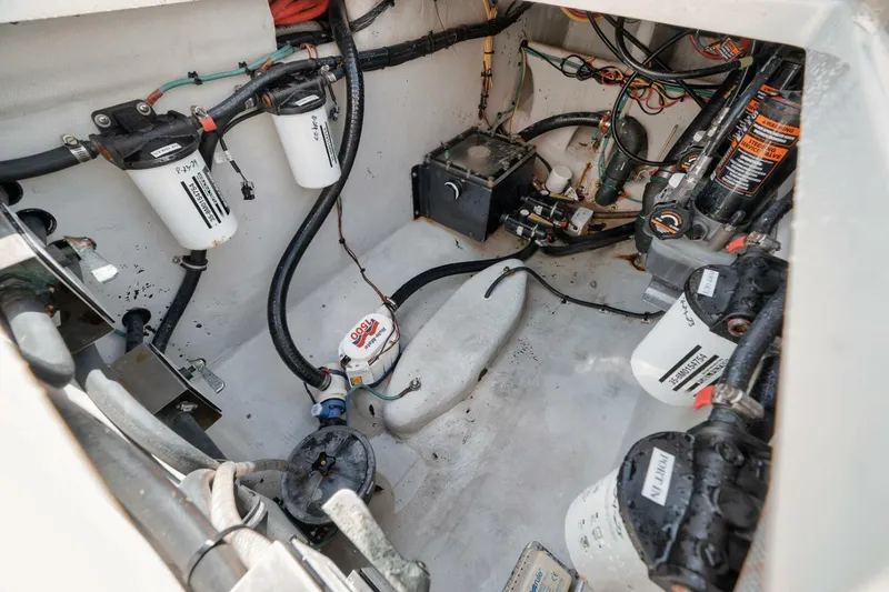 Slide: The Image of Engine compartment of a 2020 SeaVee 39 boat, showcasing filters and wiring. - 38