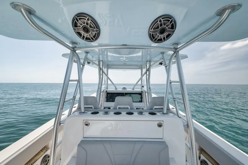 Slide: The Image of 2020 SeaVee 39 boat interior with ocean view, featuring modern helm and seating. - 41
