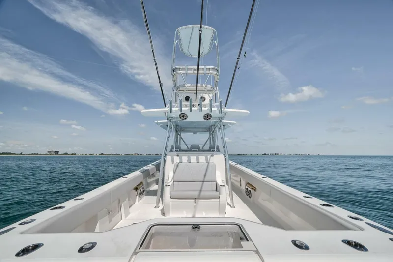 Slide: The Image of 2020 SeaVee 39 boat on open water under clear blue sky. - 42