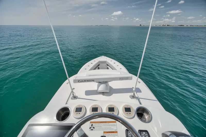 Slide: The Image of 2020 SeaVee 39 boat dashboard with Garmin equipment on open water. - 43