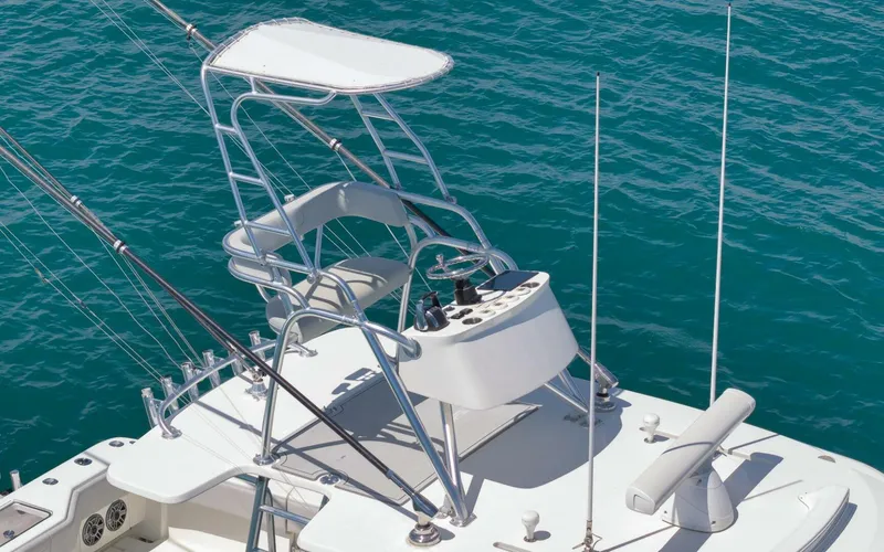 Slide: The Image of 2020 SeaVee 39 boat with tower and fishing rods on blue ocean water. - 48