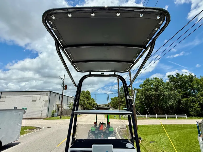 Slide: The Image of 2015 SCB Recon boat with T-top on a sunny day, street view. - 11