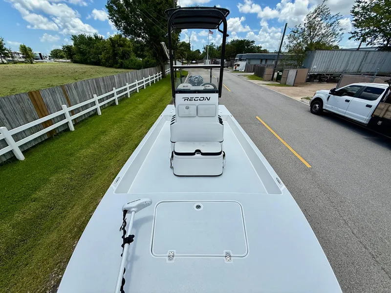 Slide: The Image of 2015 SCB Recon boat on road, white deck, clear sky, and surrounding greenery. - 15