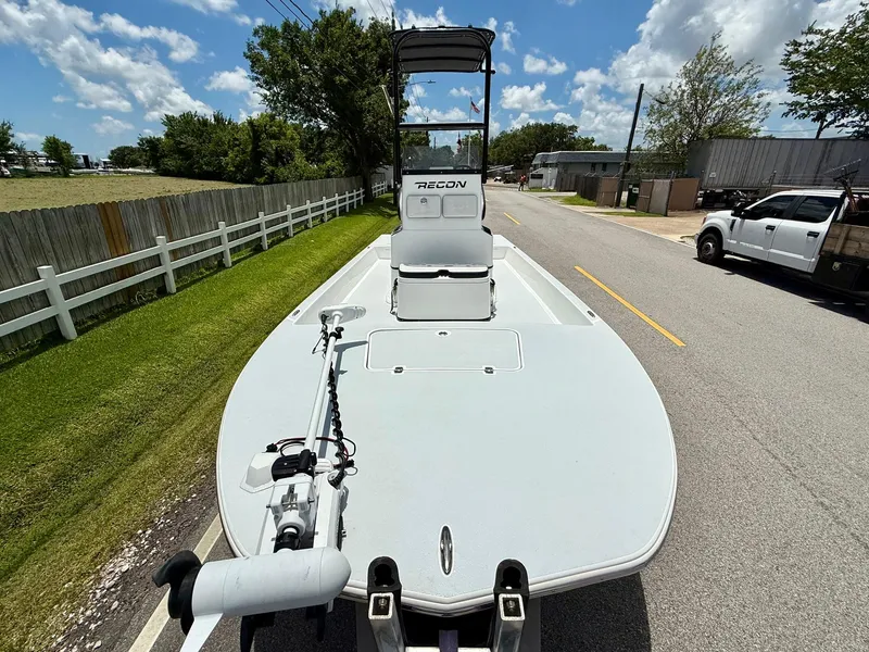 Slide: The Image of 2015 SCB Recon boat on trailer, parked on a sunny street. - 6