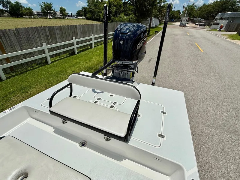 Slide: The Image of 2015 SCB Recon boat with outboard motor on a sunny day. - 7