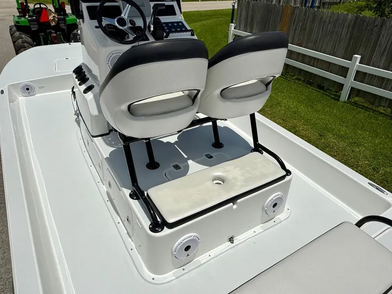 Slide: The Image of 2015 SCB Recon boat interior with dual seats and steering console. - 8