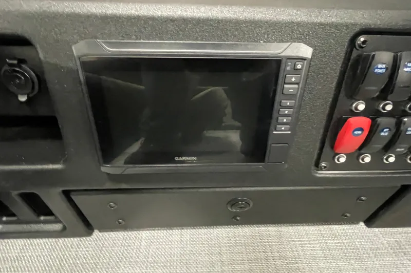 Slide: The Image of 2026 Alumacraft Competitor 175X Tiller dashboard with Garmin display and control panel. - 14