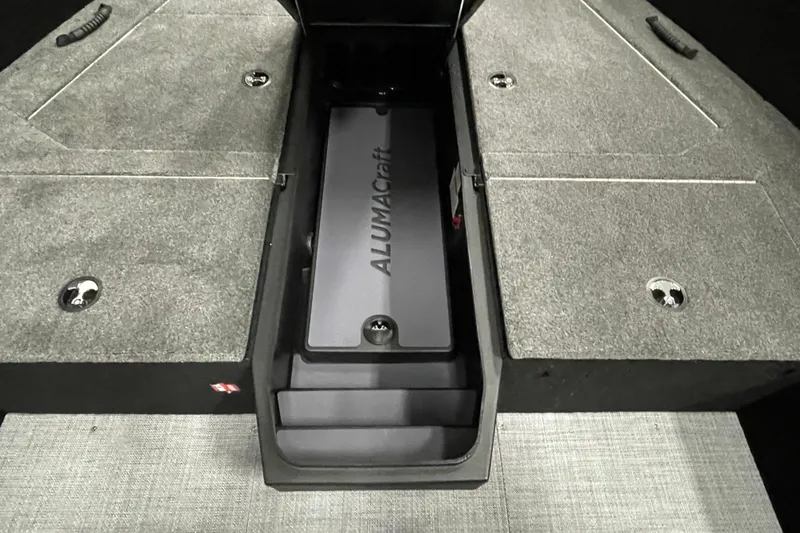 Slide: The Image of 2026 Alumacraft Competitor 175X Tiller boat interior with storage compartments. - 6