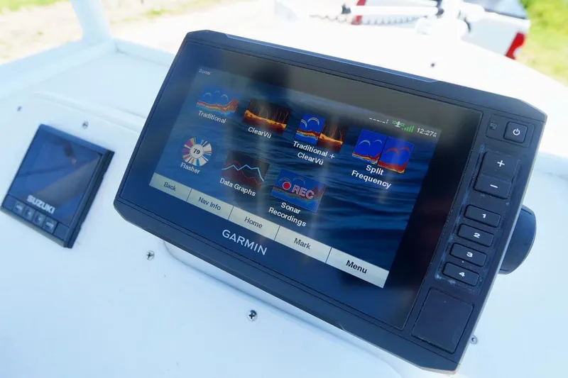 Slide: The Image of Garmin marine GPS system on 2003 Key Largo 186 CC boat dashboard. - 15