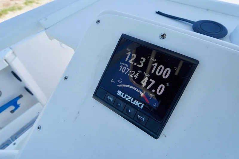 Slide: The Image of Digital display on 2003 Key Largo 186 CC boat dashboard showing engine metrics. - 16