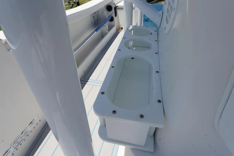 Slide: The Image of 2003 Key Largo 186 CC boat interior with cup holders and white finish. - 18