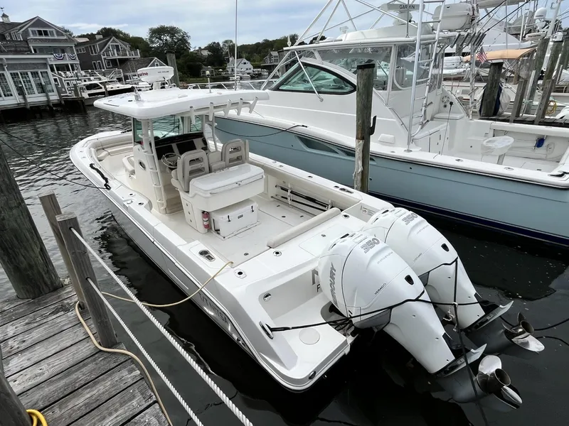 Slide: The Image of 2018 Boston Whaler 330 Outrage boat docked with twin engines. - 5