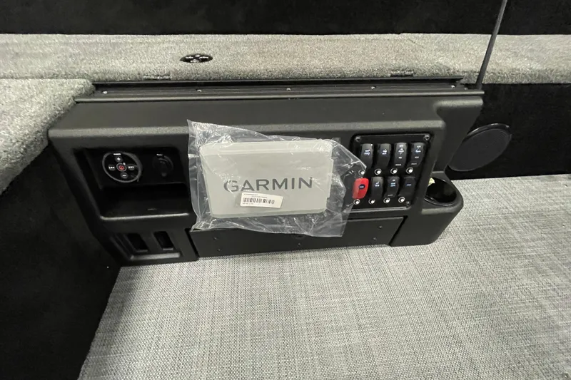 Slide: The Image of 2026 Alumacraft Competitor 185X Tiller dashboard with Garmin device and control panel. - 11