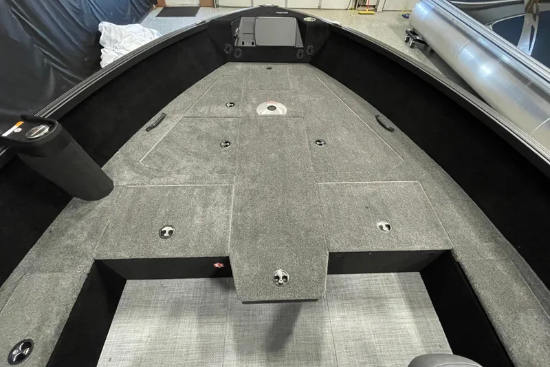 Slide: The Image of 2026 Alumacraft Competitor 185X Tiller boat interior with spacious deck and storage compartments. - 8