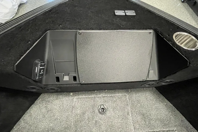 Slide: The Image of Interior of 2026 Alumacraft Competitor 185X Tiller boat, featuring storage and USB port. - 9