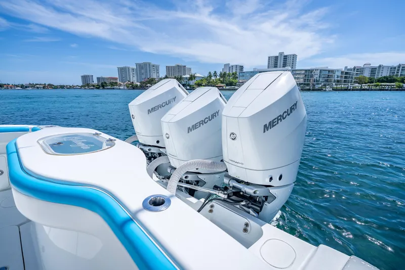 Slide: The Image of 2016 Yellowfin 39 Offshore boat with triple Mercury engines on blue water. - 18