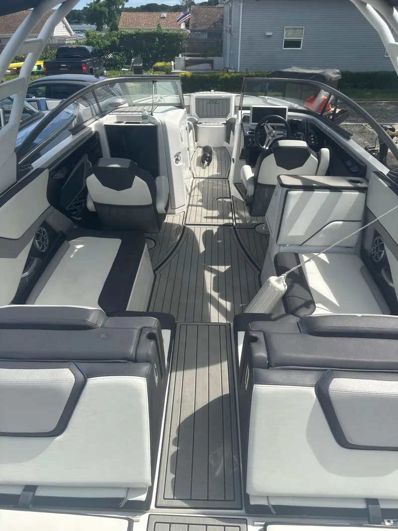 Slide: The Image of 2021 Yamaha Boats 252S interior with sleek seating and modern design. - 13