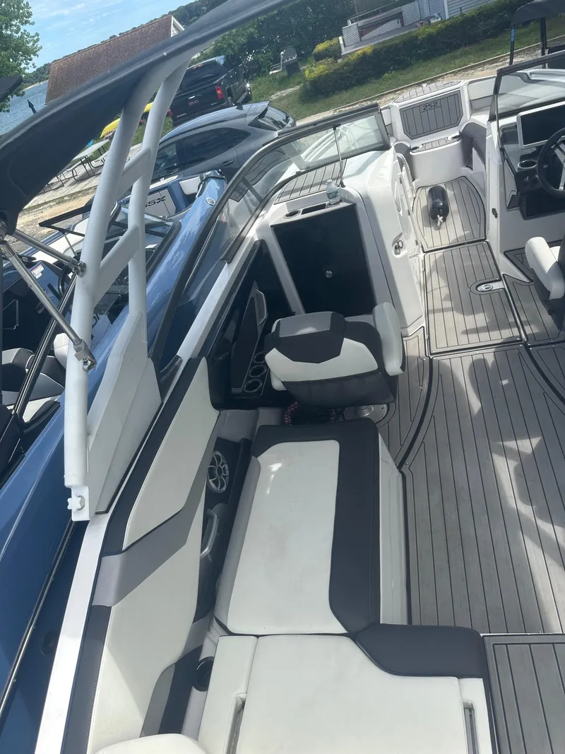 Slide: The Image of 2021 Yamaha Boats 252S interior with sleek seating and modern design. - 14