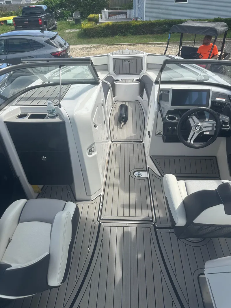 Slide: The Image of 2021 Yamaha Boats 252S interior with modern dashboard and seating. - 15