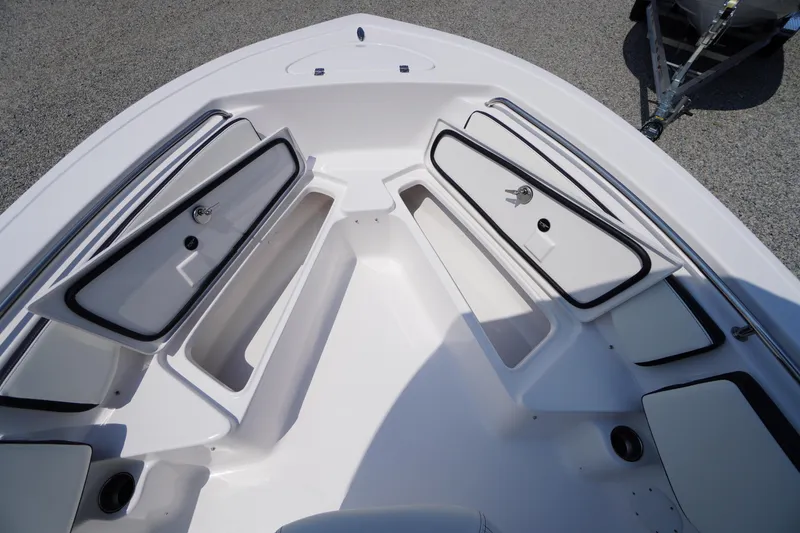 Slide: The Image of 2026 Tidewater 198 CC Adventure boat interior with open storage compartments. - 12