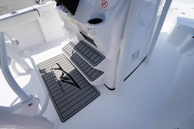Slide: The Image of 2026 Tidewater 198 CC Adventure boat interior with branded non-slip mats. - 28