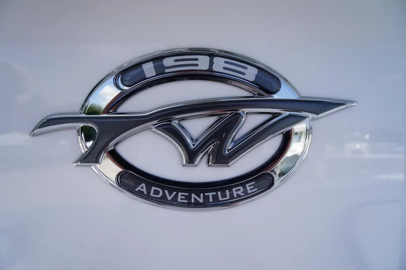 Slide: The Image of Tidewater 198 CC Adventure 2026 emblem on white background. - 3